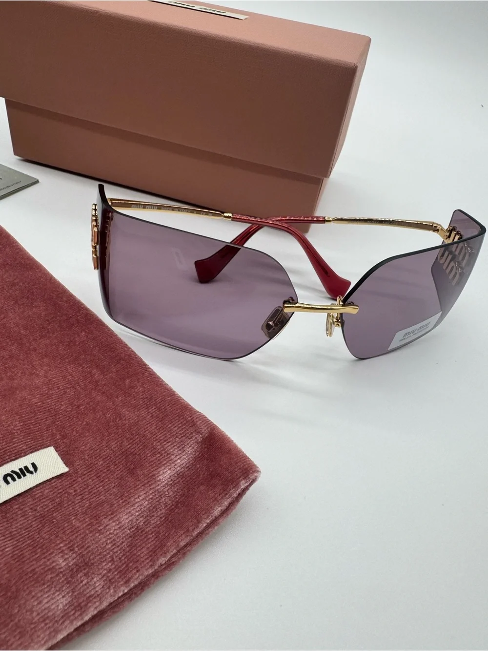 Miu Miu Purple Rimless Sunglasses with Gold Accents